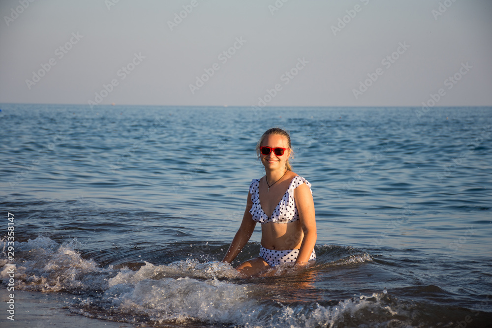 Teenager girl  posing at the beach