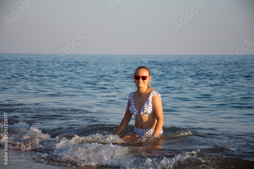 Teenager girl posing at the beach