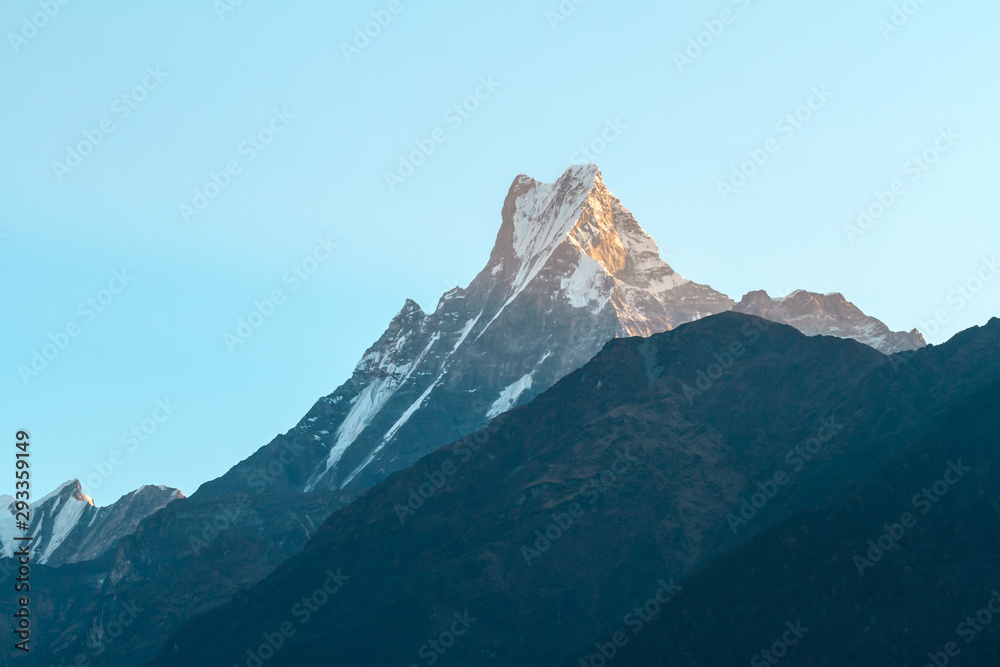Mount Machapuchare (Fishtail) on sunrise on the way to Chomrong. Annapurna Conservation Area, Himalaya, Nepal.
