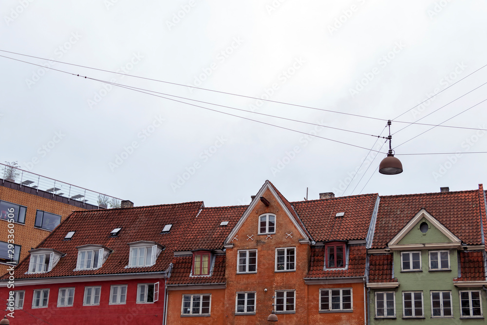 Colorful old town street with wooden rustic houses, typical Danish capital architecture