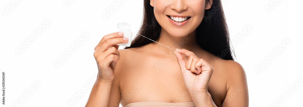 partial view of smiling woman with dental floss isolated on white