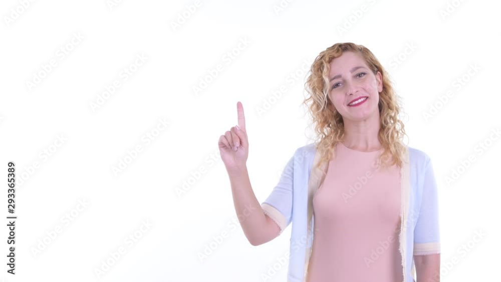 Happy beautiful blonde woman pointing up Happy beautiful blonde woman pointing up