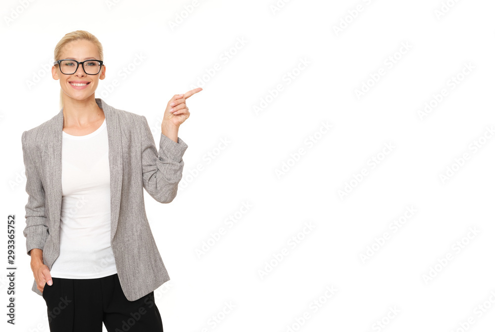 Female worker in eyeglasses is showing sth by finger. Female worker in eyeglasses is showing sth by finger.