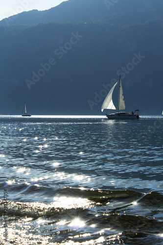 vertical view sailing yacht boats in lake bouget mountain savoie french alps riviera photo