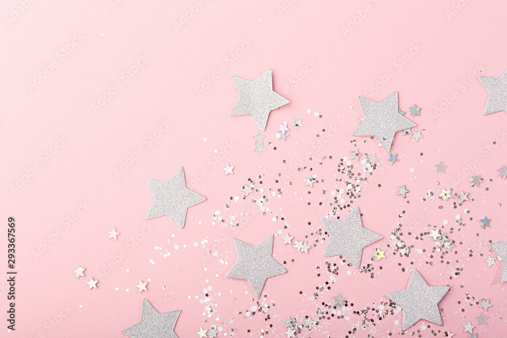 Fototapeta silver glitter with stars on a pink background, copy space