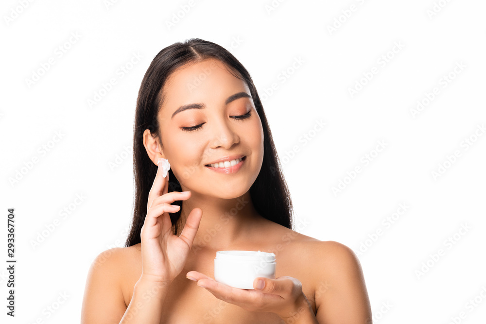 smiling naked beautiful asian woman applying cosmetic cream isolated on white smiling naked beautiful asian woman applying cosmetic cream isolated on white