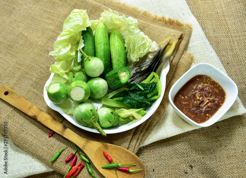 Chili paste and a touch of fresh vegetables cooked in a white dish put on sackcloth. Popular food of Thailand