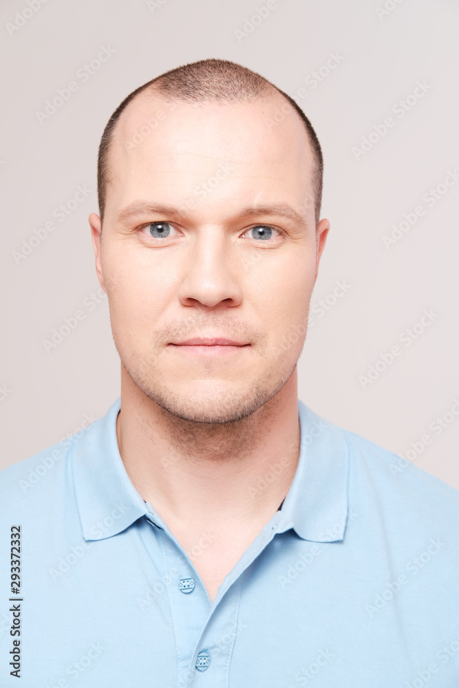 portrait of mid adult man against plain background portrait of mid adult man against plain background