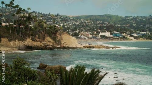 Waves wash up along the shoreline on a summer day at Laguna Beach, CA