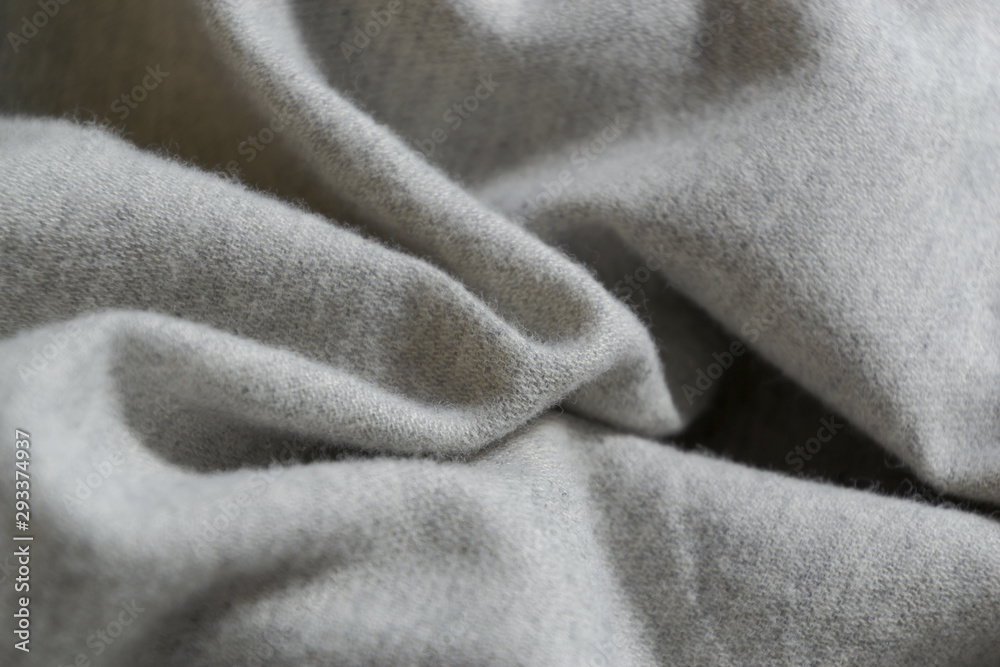 A natural organic soft wavy crumpled gray cotton fabric surface, texture background