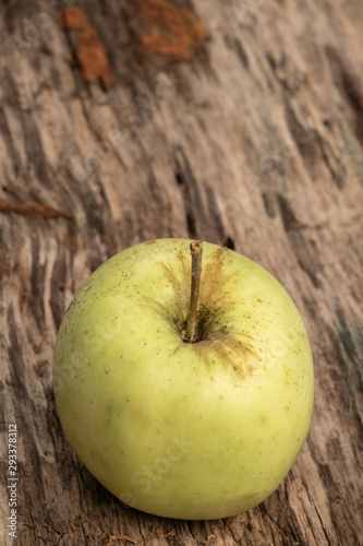 natural and healthy green apple on a wooden table with copy space