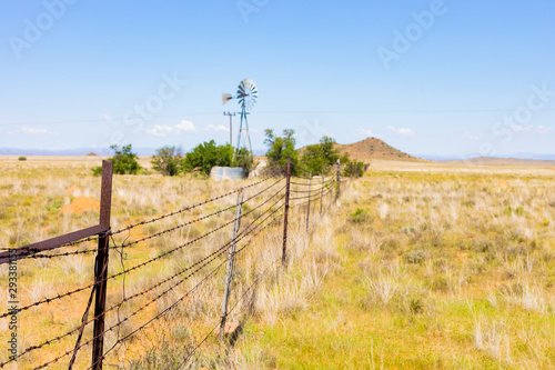 Photography Windmill on a farm in rural grassland area of South Africa