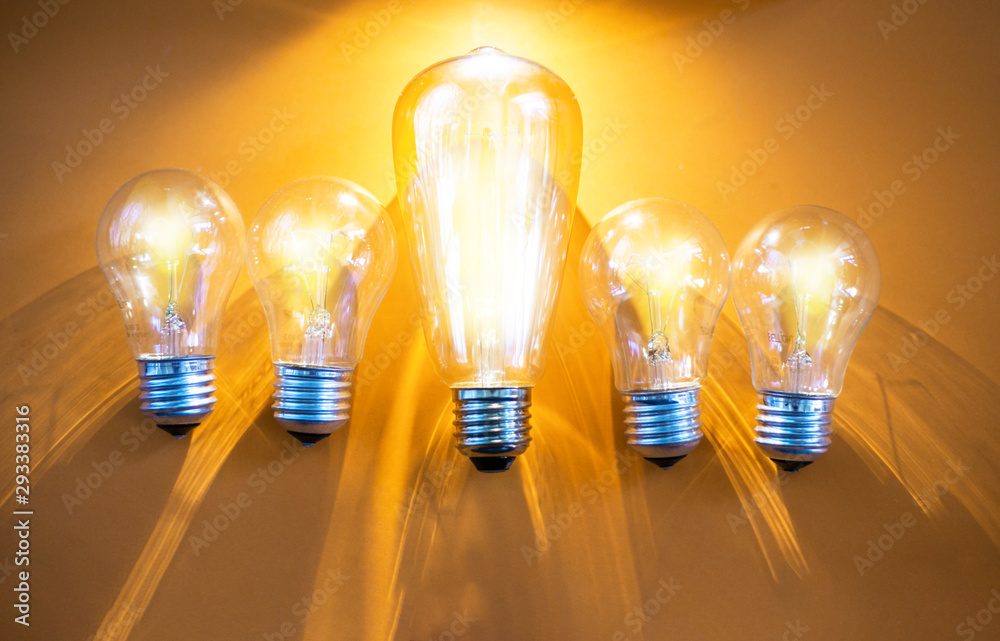 Five bulbs on a yellow background and all of them is glowing. Five bulbs on a yellow background and all of them is glowing.