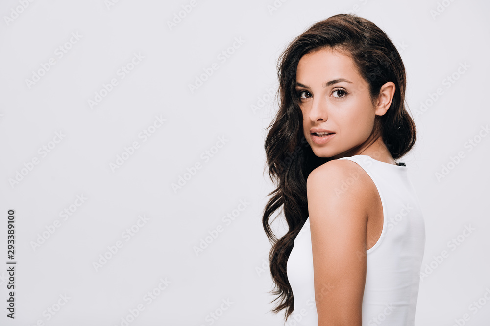 brunette beautiful woman with long curly healthy hair isolated on grey brunette beautiful woman with long curly healthy hair isolated on grey