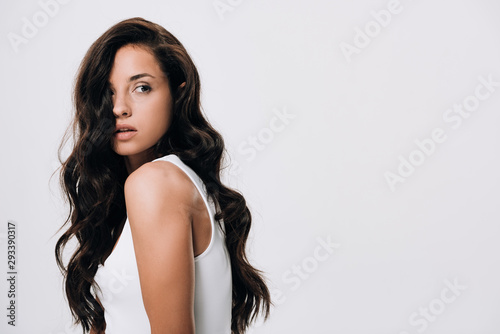 Valokuva brunette beautiful woman with long healthy and shiny hair looking away isolated
