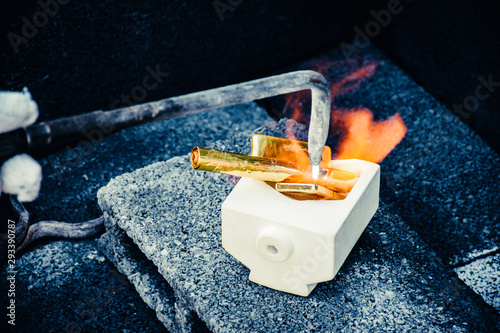 Obraz na plátně Pure Gold in the crucible is melted by heat fire from gas nozzle.