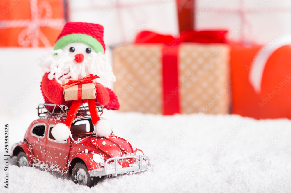 Fototapeta premium New year Santa delivering presents by car on background