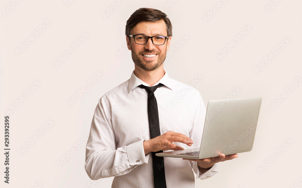 Successsful Man Working On Laptop Standing Over White Background Successsful Man Working On Laptop Standing Over White Background