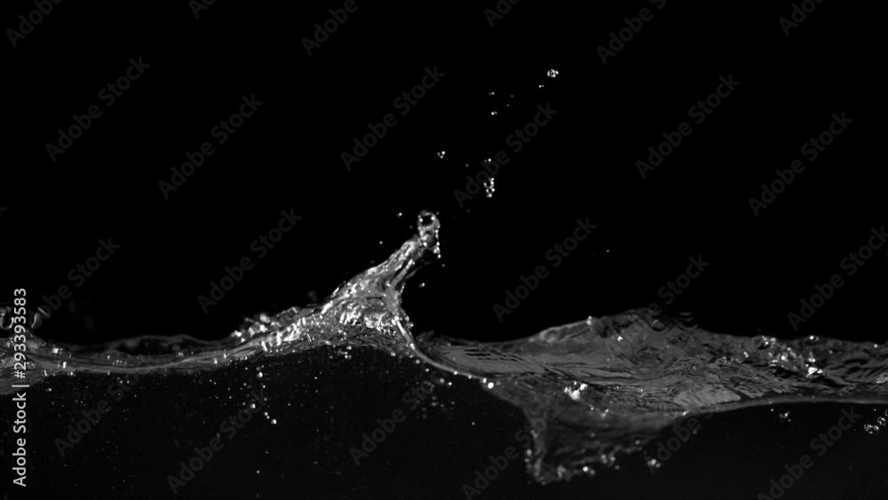 Super slow motion of splashing water isolated on black background. Filmed on very high speed camera, 1000 fps.