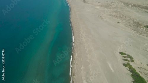 Aerial view of beautiful lonely beach and Paoay sand dune. Philippines, Luzon. Ilocos Norte. Large island with a wide beach.