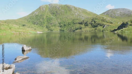 Stone is Being Thrown in Dinglavatnet in the Beautiful Norway Europe photo