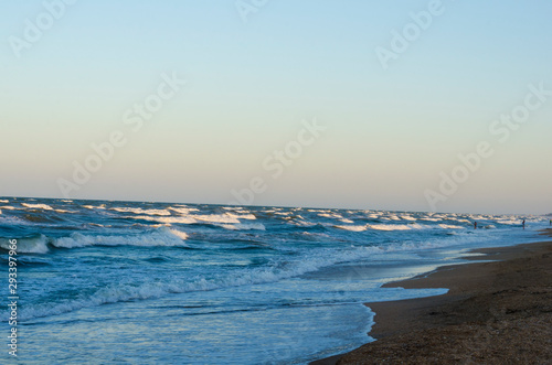 Photo of a sea beach with waves