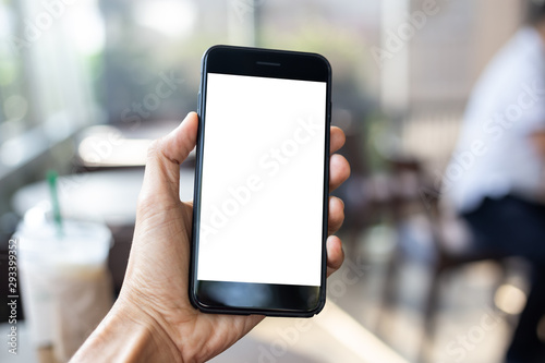 man hand using smartphone In the coffee shop,Screen blank