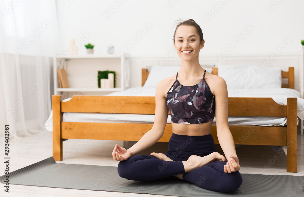Happy woman doing yoga exercise at home Happy woman doing yoga exercise at home