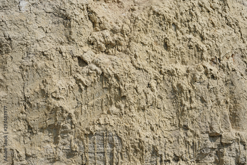 Texture of different layers of clay underground in a clay quarry. clay wall background close up