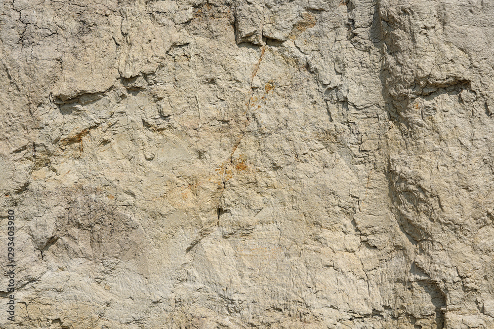 Texture of different layers of clay underground in a clay quarry. clay wall background close up Texture of different layers of clay underground in a clay quarry. clay wall background close up