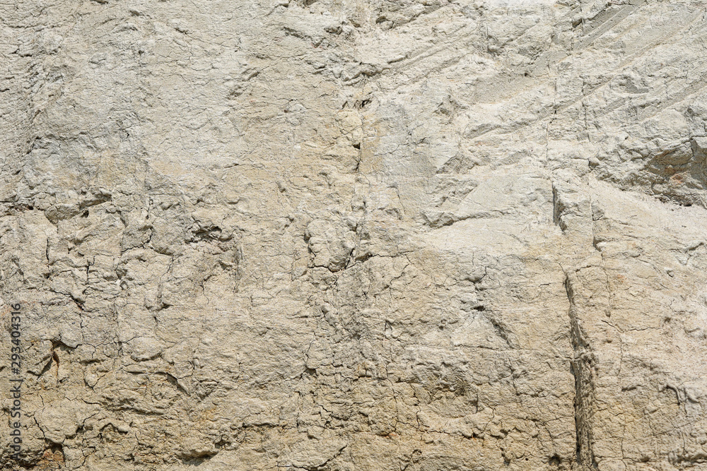 Texture of different layers of clay underground in a clay quarry. clay wall background close up Texture of different layers of clay underground in a clay quarry. clay wall background close up