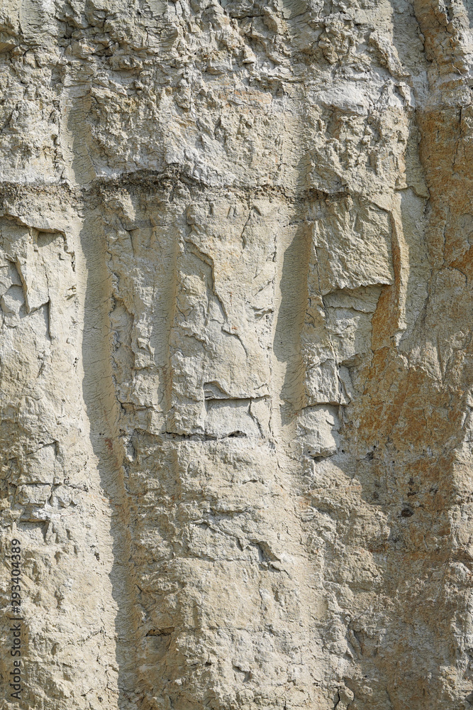 Texture of different layers of clay underground in a clay quarry. clay wall background close up