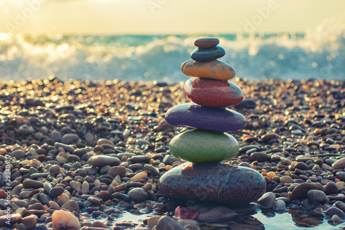 Zen concept. The object of the colorful stones on the beach. Meditation