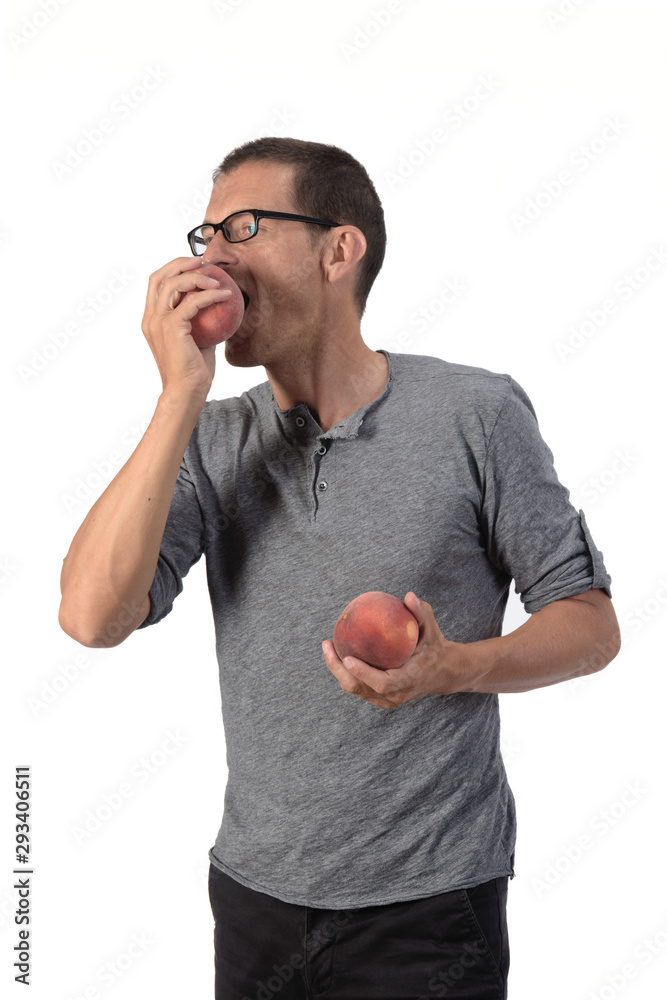 man with peach on white background man with peach on white background