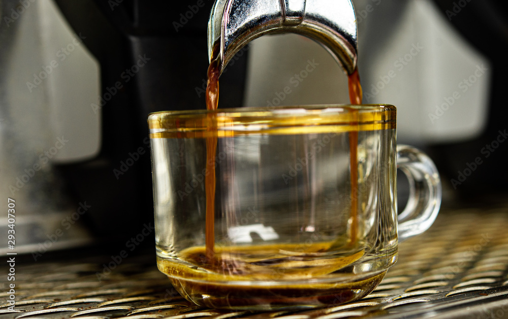 Closeup coffee machine making fresh espresso coffee into a cup with blurred background. Closeup coffee machine making fresh espresso coffee into a cup with blurred background.