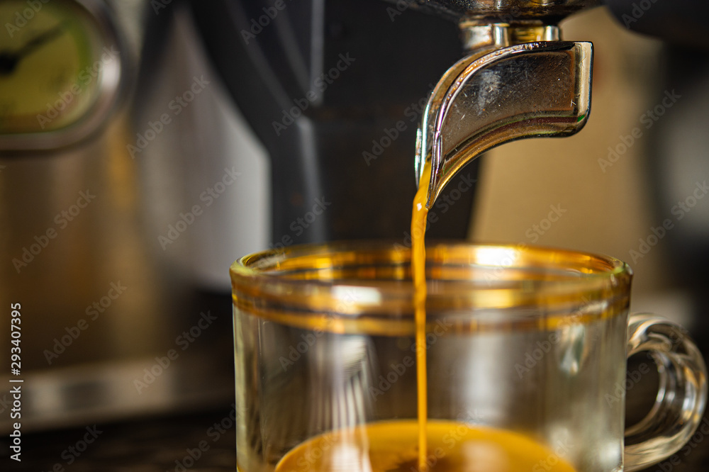 Closeup coffee machine making fresh espresso coffee into a cup with blurred background. Closeup coffee machine making fresh espresso coffee into a cup with blurred background.