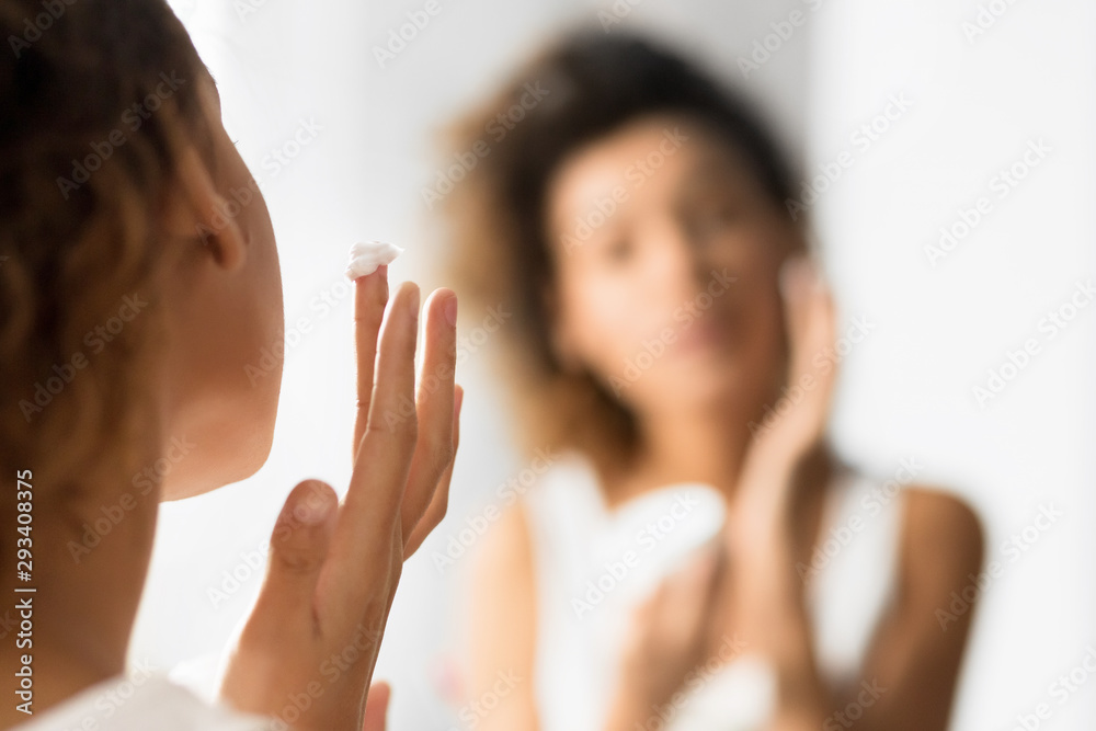 Unrecognizable Young Lady Applying Face Cream In Bathroom Unrecognizable Young Lady Applying Face Cream In Bathroom