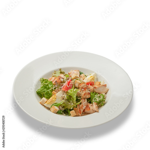Caesar salad with chicken. Healthy food. Isolated on white background.