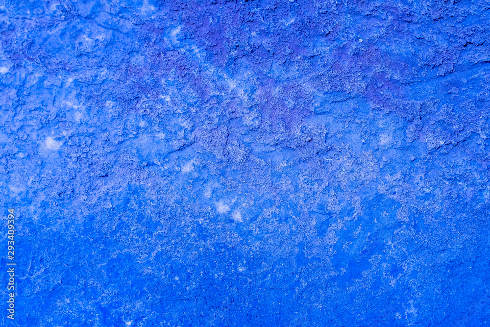 blue stone wall background close up ,texture of decorative plaster ,colored stucco , abstract macro blue stone wall background close up ,texture of decorative plaster ,colored stucco , abstract macro