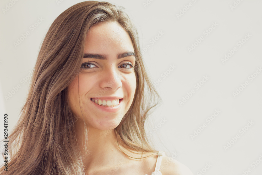 Portrait of young brazilian woman on white background looking at camera. Portrait of young brazilian woman on white background looking at camera.