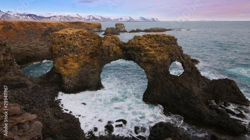 Natural rock gate in Arnarstapi, Snafellsnes peninsula, Iceland photo