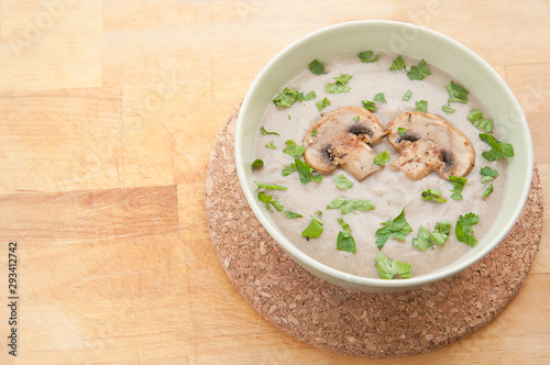 Hot cream soup with parsley.