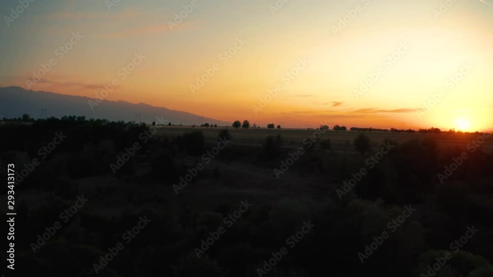Drone aerial sunset view of mountain, pan left shot Drone aerial sunset view of mountain, pan left shot