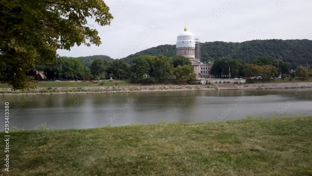 View of the West Virginia State Capitol with scaffolding and wrapped for repairs and repainting. View of the West Virginia State Capitol with scaffolding and wrapped for repairs and repainting.