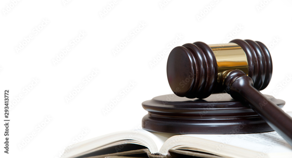 wooden gavel and books on wite background