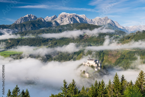 Hohenwerfen Castle in Austria. Foggy morning in Autumnal Season photo