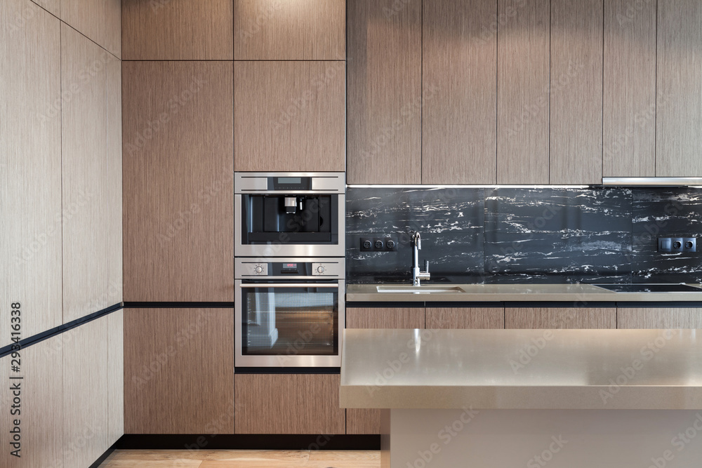 Fototapeta premium Modern and new kitchen with built in appliance