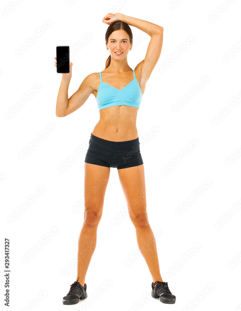 Cheerful young fitness woman showing blank smartphone screen isolated over white background Cheerful young fitness woman showing blank smartphone screen isolated over white background