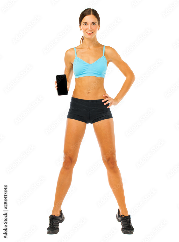 Cheerful young fitness woman showing blank smartphone screen isolated over white background Cheerful young fitness woman showing blank smartphone screen isolated over white background