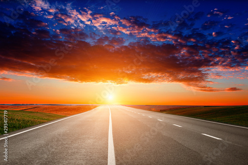 Asphalt highways and mountains under the blue sky